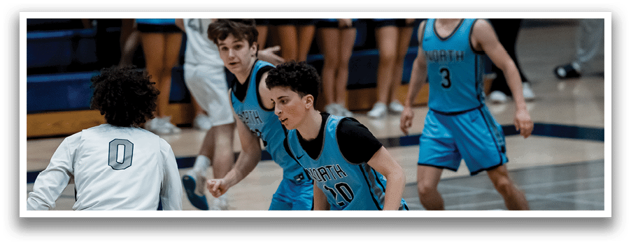 A group of young men playing basketball on a court. AI generated content
