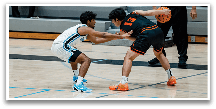 Two men are playing basketball, one is trying to steal the ball from the other. AI generated content