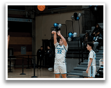 A group of people playing basketball on a court. A woman is jumping to shoot the ball. AI generated content