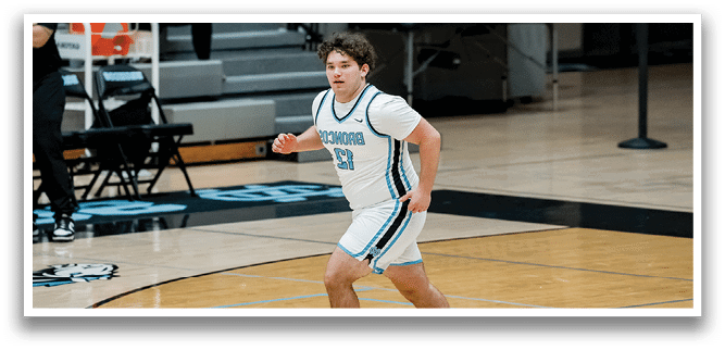 A man in a white uniform is running on a basketball court. AI generated content