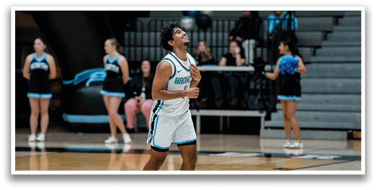 A man in a basketball uniform is celebrating on the court. AI generated content
