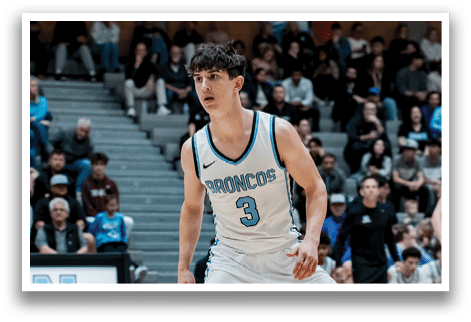 Two basketball players on a court, one wearing a blue jersey and the other wearing a white jersey. AI generated content