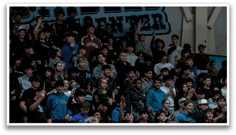 A large crowd of people are watching a game in a gymnasium. AI generated content