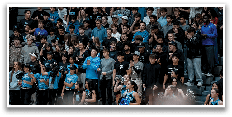 A group of people are sitting in the bleachers, watching a game. AI generated content