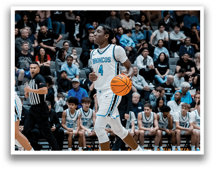 A group of young men playing basketball in a gym. AI generated content