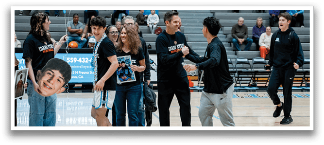 A group of people pose with a cardboard cutout of a basketball player. AI generated content