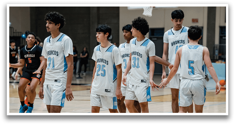 A group of young men wearing white uniforms and blue shorts are walking on a basketball court. AI generated content