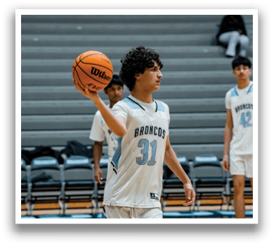 A man holding a basketball on a basketball court. AI generated content