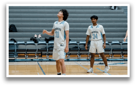 A group of basketball players are standing on a court, waiting for the game to start. AI generated content