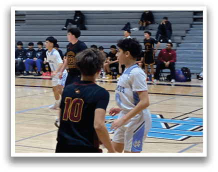 A group of young men playing basketball on a court. AI generated content