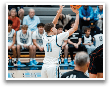 A basketball player is holding a basketball in front of a crowd of people. AI generated content