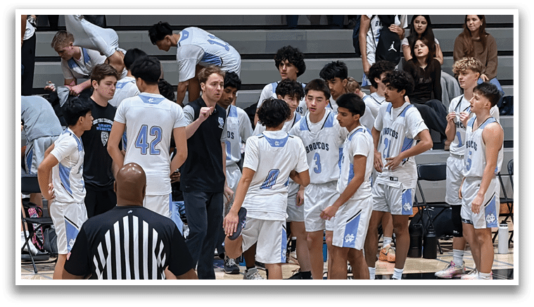 A group of young men are gathered on a basketball court, engaged in a conversation. AI generated content