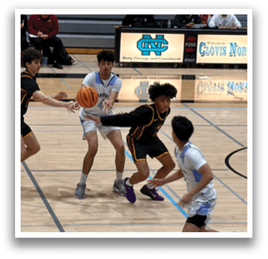 A group of young men playing basketball on a court. AI generated content