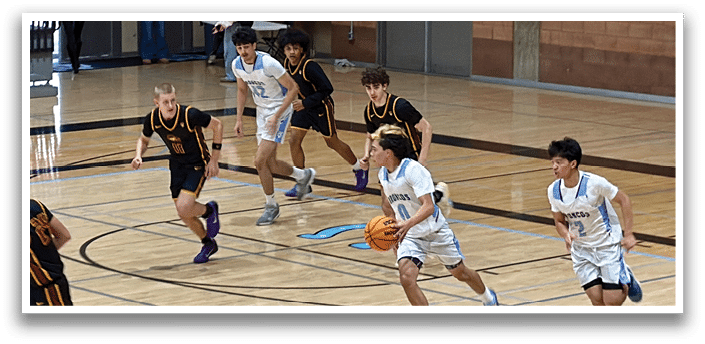 A group of young men playing basketball on a court. AI generated content