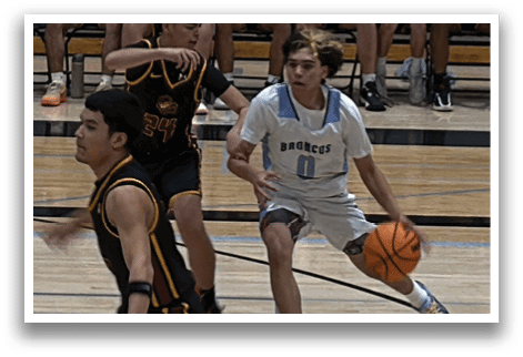 A basketball game is taking place with two teams playing. One player is holding a basketball and is about to shoot it. The other players are in various positions on the court, some of them are wearing red and black uniforms. AI generated content