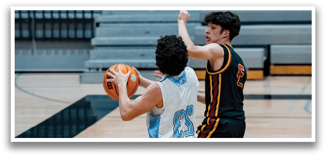 A group of men playing basketball on a court. AI generated content