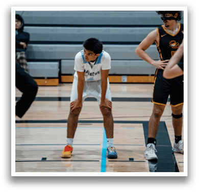 A scoreboard in a gym shows the score of a basketball game. AI generated content