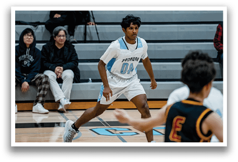 A group of young men playing basketball on a court. AI generated content