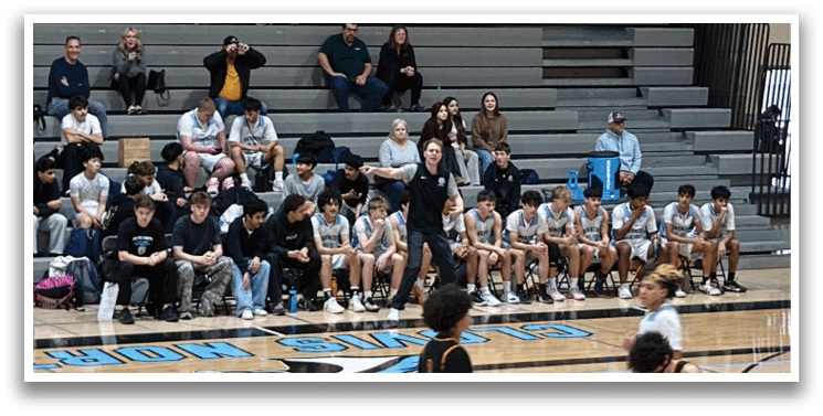 A group of people are sitting on a bench in a gym. AI generated content