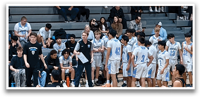 A group of people are sitting on bleachers, watching a basketball game. AI generated content