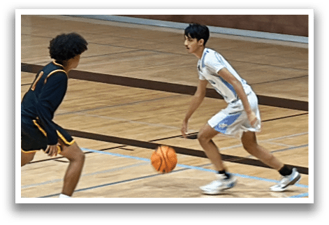 Two basketball players on a court, one with a ball and the other trying to block. AI generated content