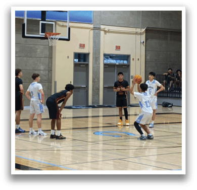 A group of young men playing basketball on a court. AI generated content