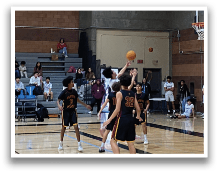 A group of people playing basketball on a court. AI generated content