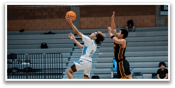 A group of people are sitting on a bench, watching a basketball game. AI generated content