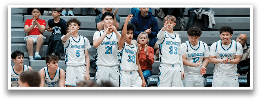 A group of young men are playing basketball on a court. AI generated content