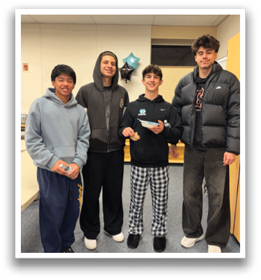Four people are standing in a room, posing for a picture. They are wearing pajamas and holding food. AI generated content