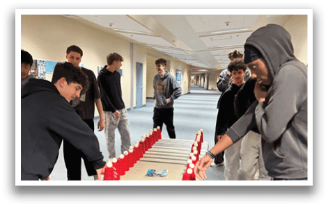 A group of people are playing a game of beer pong in a hallway. AI generated content