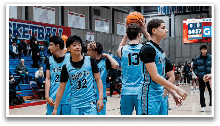 A group of men wearing blue uniforms are standing on a basketball court, engaged in a conversation. AI generated content