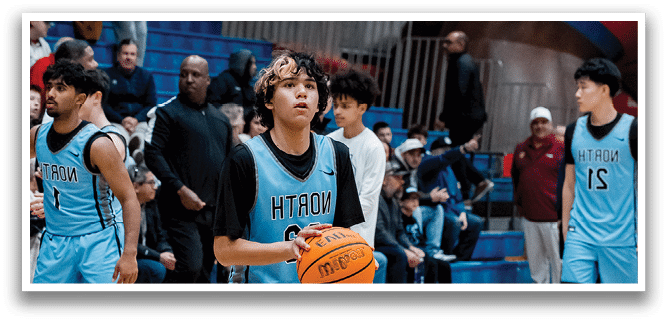 A basketball player wearing a blue jersey holds a basketball on a court. AI generated content