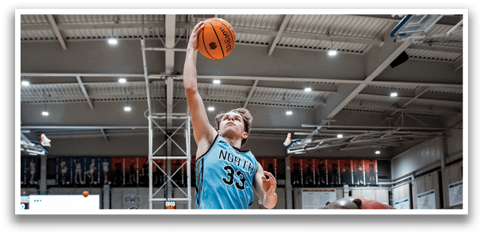 A basketball player is jumping in the air to catch a ball. AI generated content