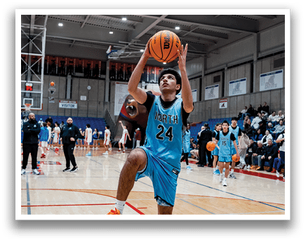 A basketball player in a blue uniform is jumping to catch a basketball. AI generated content