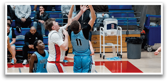 Two men are playing basketball, one of them is trying to block the other's shot. AI generated content
