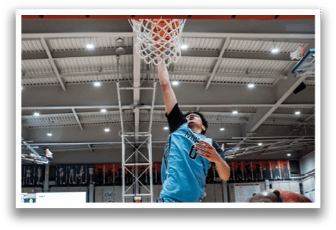 A basketball player jumps to hit the ball in a game. AI generated content