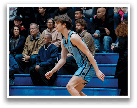 A man in a blue uniform is playing basketball on a court. AI generated content