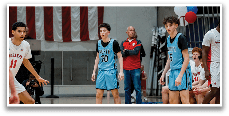 A group of young men playing basketball on a court. AI generated content