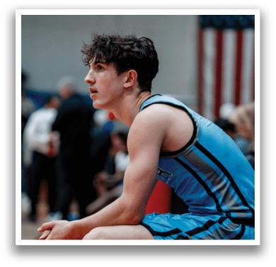 A man wearing a blue shirt and shorts is sitting on a bench. AI generated content