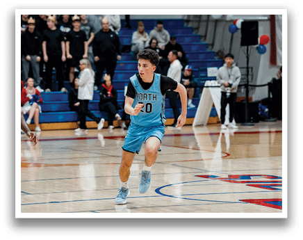 A boy in a blue basketball uniform is running on a basketball court. AI generated content