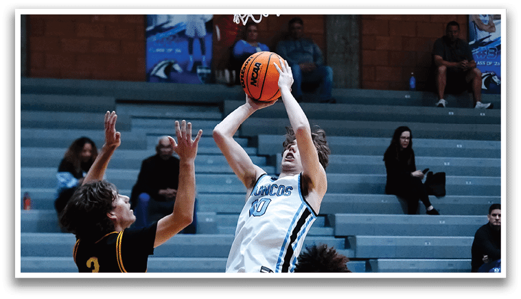 A basketball player is jumping to catch the ball while two other players try to block him. AI generated content