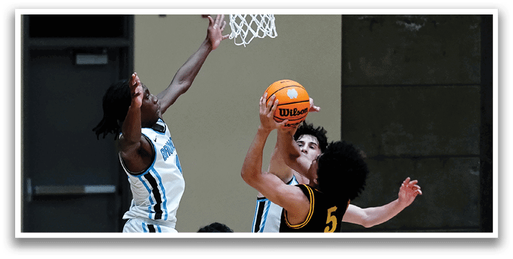 Three men are playing basketball, with one man attempting to block a shot. AI generated content