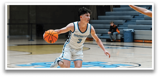Two men playing basketball, one holding a basketball and the other trying to block him. AI generated content