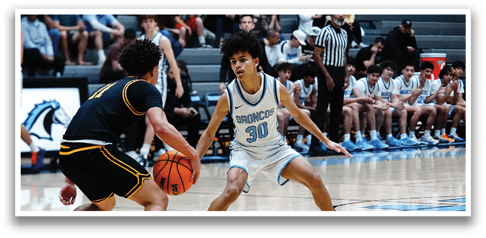 Two basketball players on the court, one with the ball and the other trying to get it. AI generated content