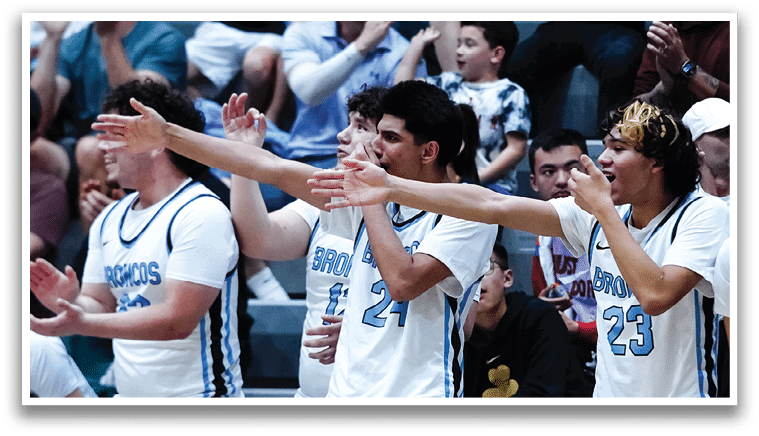 A group of young men are sitting on a bench, wearing uniforms and clapping. AI generated content
