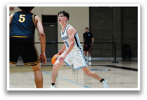 Two men playing basketball on a court. One man is holding a basketball. AI generated content