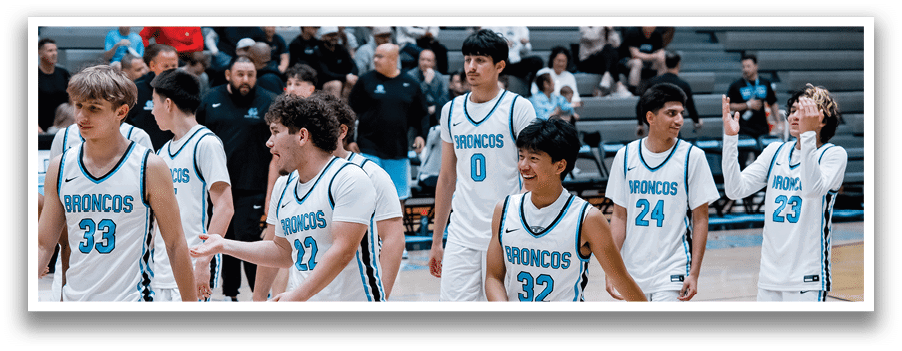 A group of young men wearing white uniforms with blue numbers on the back are walking on a basketball court. AI generated content