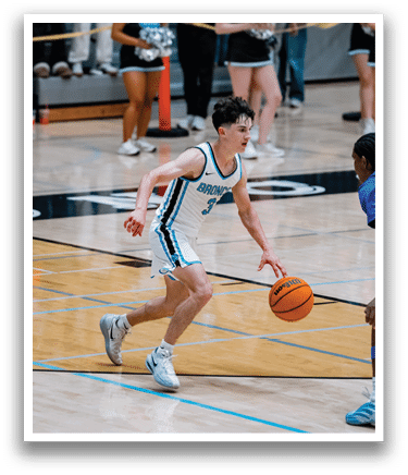 Two basketball players on a court, one with the ball and the other trying to block him. AI generated content