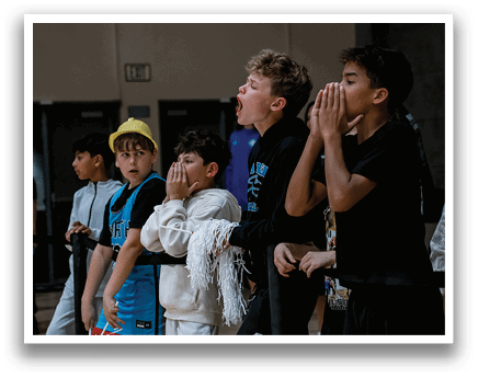 A group of young boys are standing in front of a barrier, watching an event. AI generated content